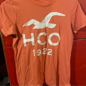 Peach colored Hollister T-shirt.